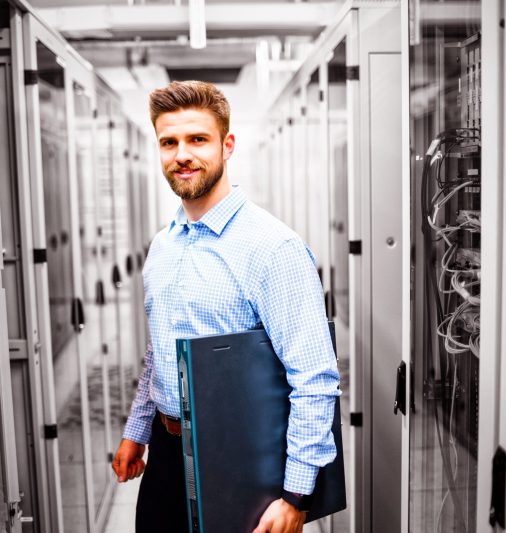 Portrait of technician holding a server in server room